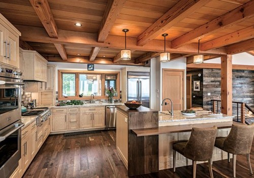 Creating Warm Interiors in Timber Frame Houses with Stylish Kitchen Cabinets